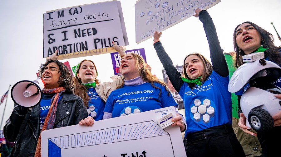 The Red State's abortion ban threatens to clash with the Blue State's shield laws